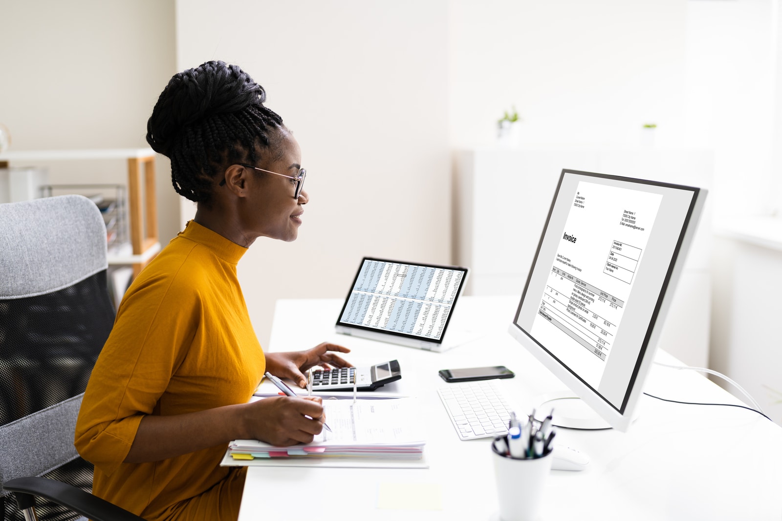 Woman completing an invoice.